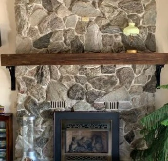 reclaimed wood mantel- co wood and metal